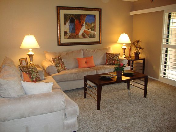 comfortable seating in living room with view of the golf cou