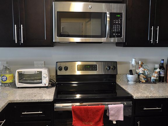 It has stainless steel microwave oven and stove top oven.
