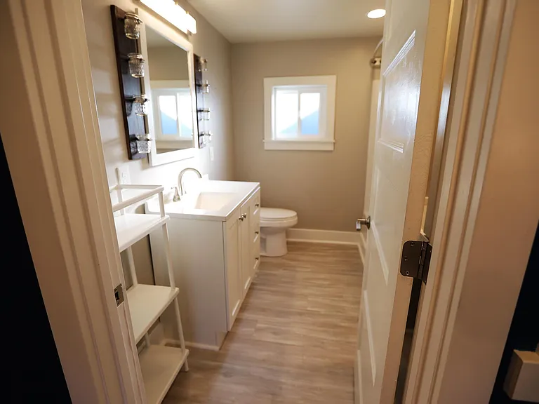 Bathroom off of kitchen/hallway.