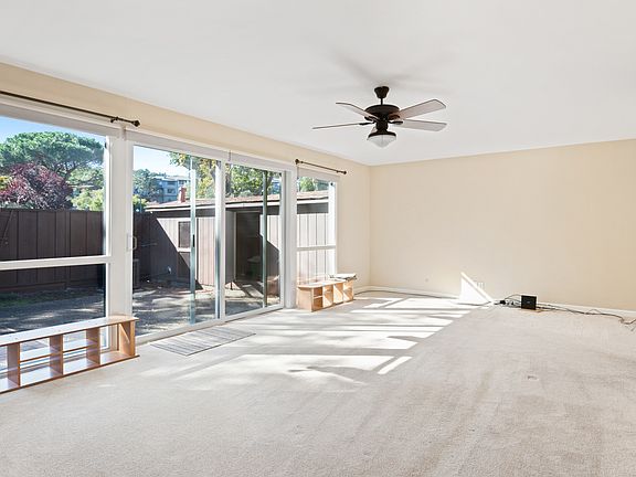 Spacious Living/ Dining Room with double paned windows and glass slider to large patio