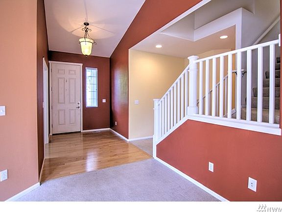 Upon entry, den on R, upstairs L