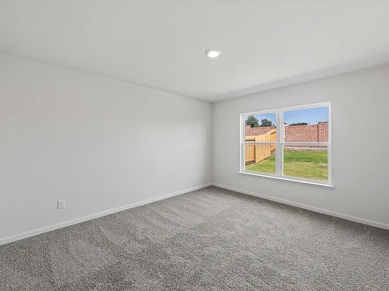 The master bedroom has a large window that lets in great, natural light.