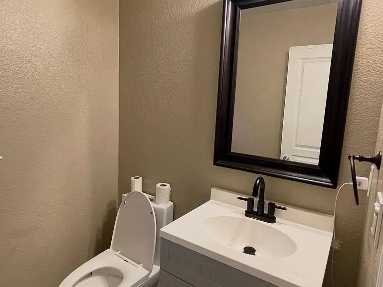2nd Floor - half bathroom with updated vanity and toilet that is less than 4 years old