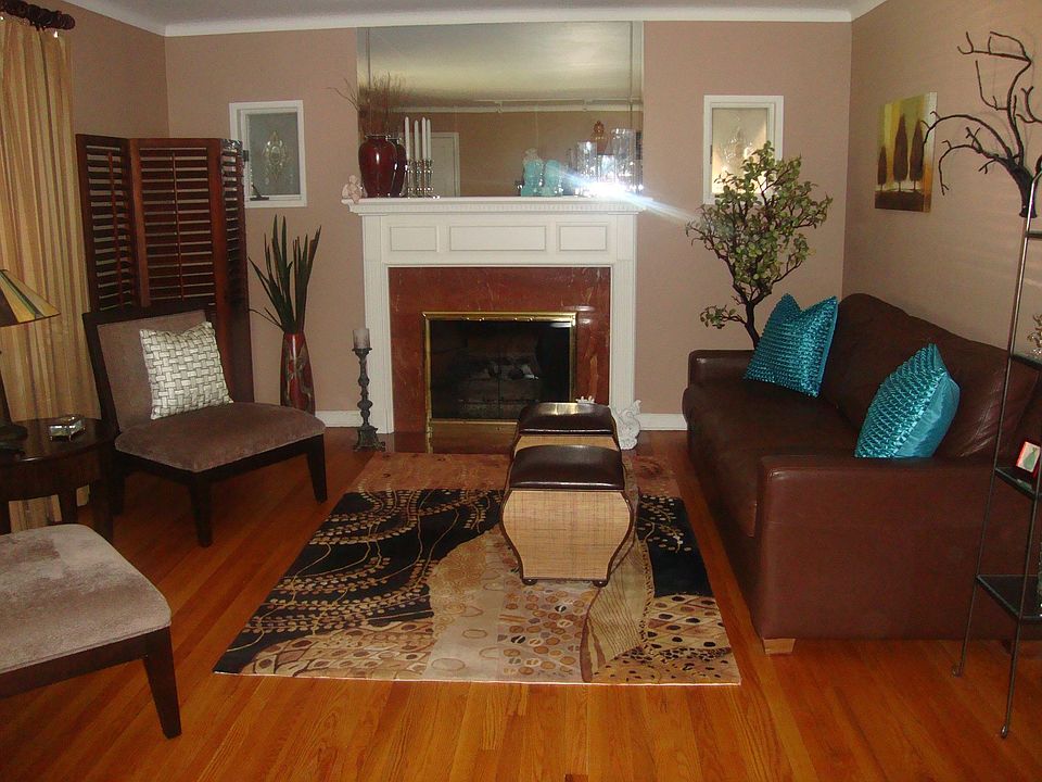 Stunning Living Room Complete with Fireplace & gleaming Hard Wood Floors!