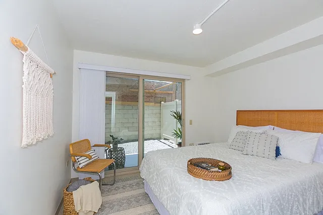 Kanekapolei Collection Bedroom with mirror doored closets and decor