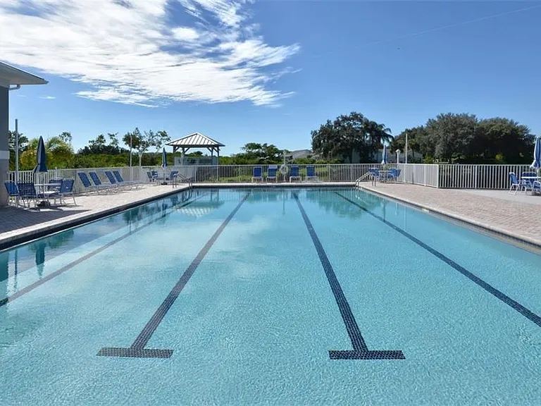 Almost Olympic size, heated pool next to the Clubhouse. Bathrooms/Changing rooms in the Clubhouse. Umbrellas can be opened at the seating areas around the pool.