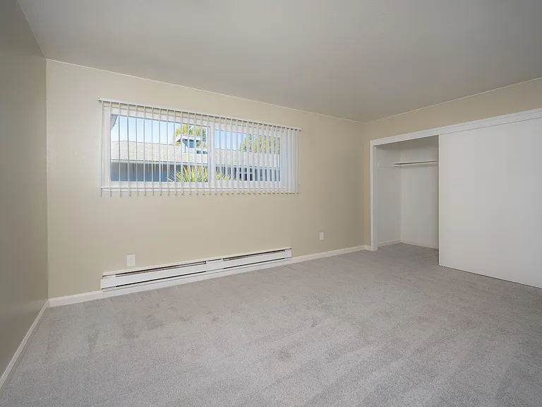 Experience comfort and tranquility in this well-lit and spacious bedroom.