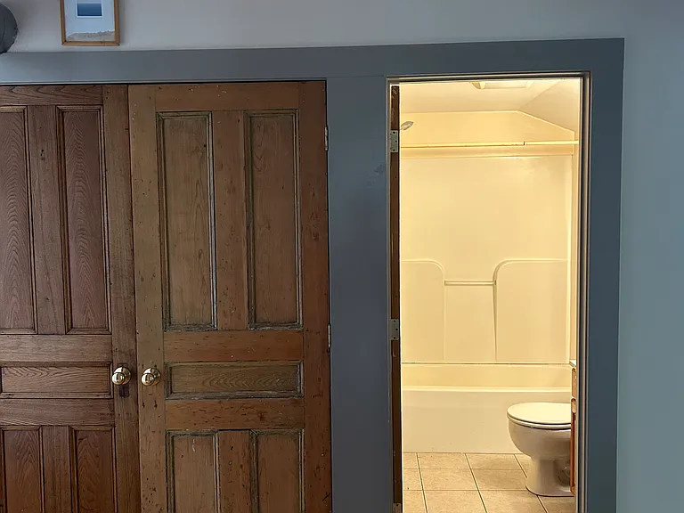 Linen closet with new washer and dryer.