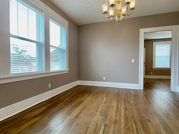 Dining room with large windows and abundant natural light