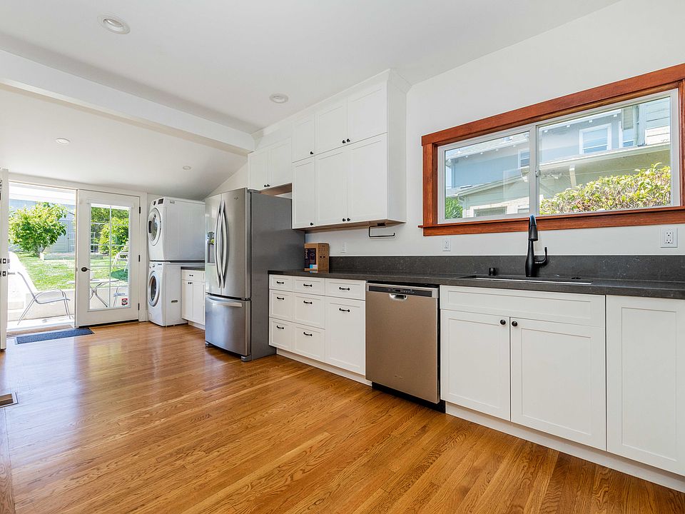 Recently renovated chef's kitchen with plenty of storage, updated stove, dishwasher, refrigerator and washer / dryer.