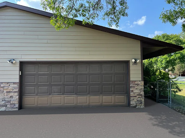 Driveway & 2-car automatic garage with wifi-enabled garage door opener.
