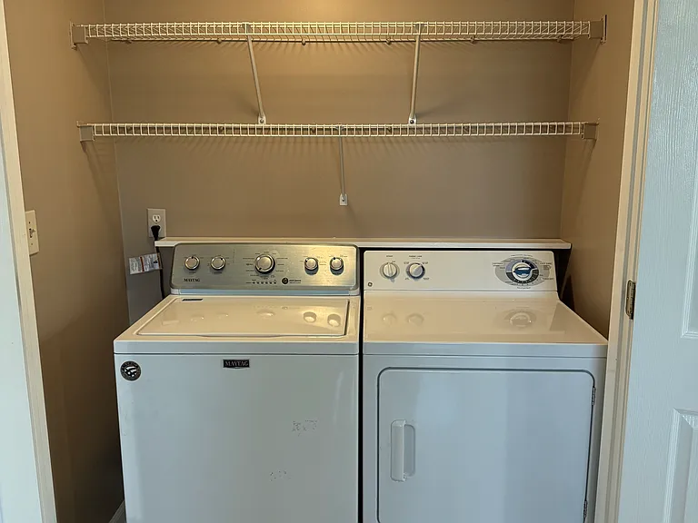 Laundry closet off kitchen; washer/dryer stays in home