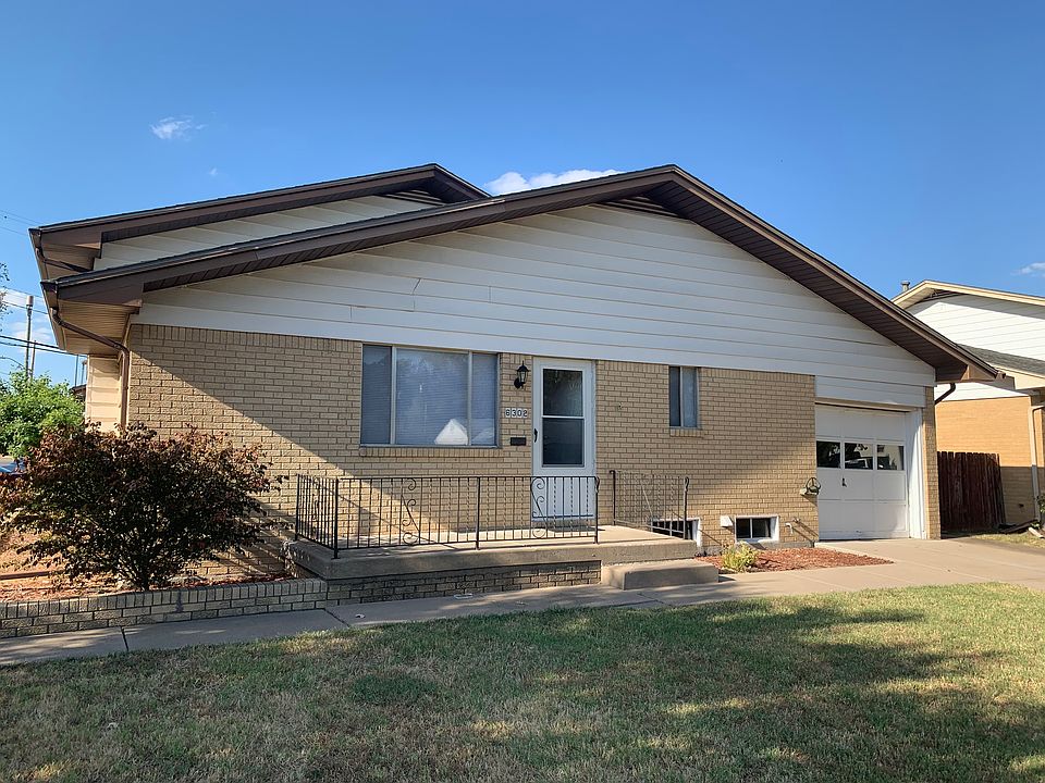 Front of 6302 with 1-car attached garage