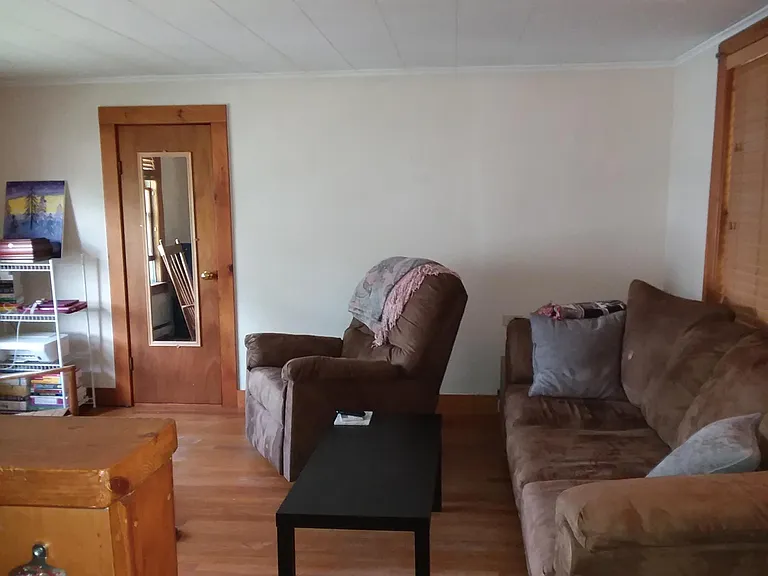 Living room, hard wood floors, double windows on 2 sides, closet storage; so nice!