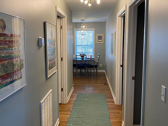 Hallway through the center of the home. First door on the right is the main bathroom with separate laundry room. Second Door on right is the master bedroom with full bathroom. Only door on the left is a large bedroom (big enough for a queen bed.)