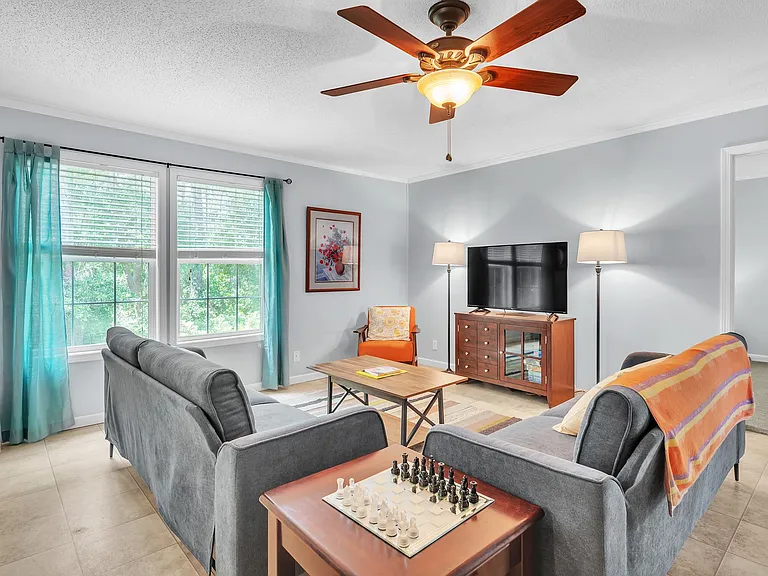 Living room with Roku TV and seating for 7