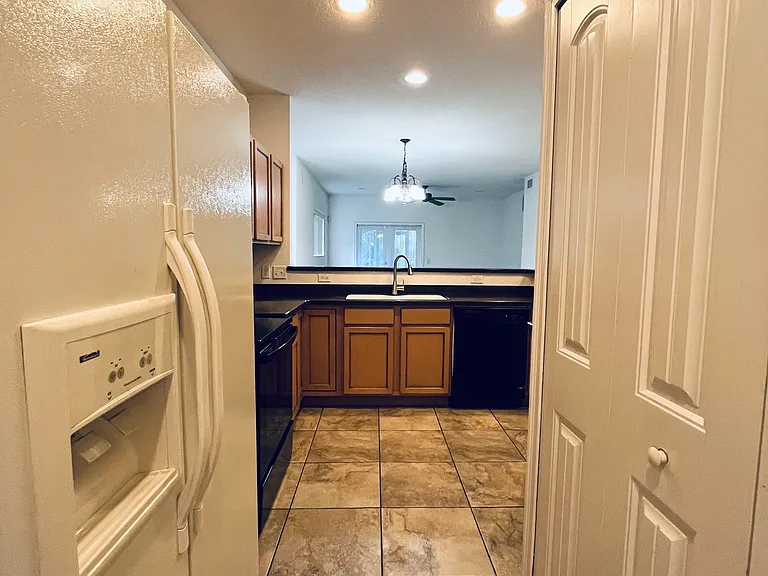 Refrigerator and Washer/Dryer area