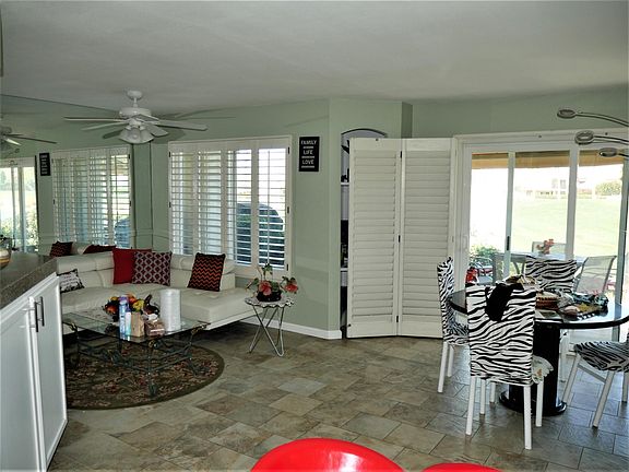 Great room floor plan with lake, fairway and mountain views.
