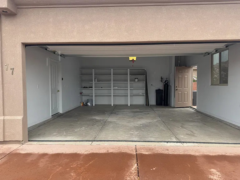 2-car garage with built-in storage & water softener