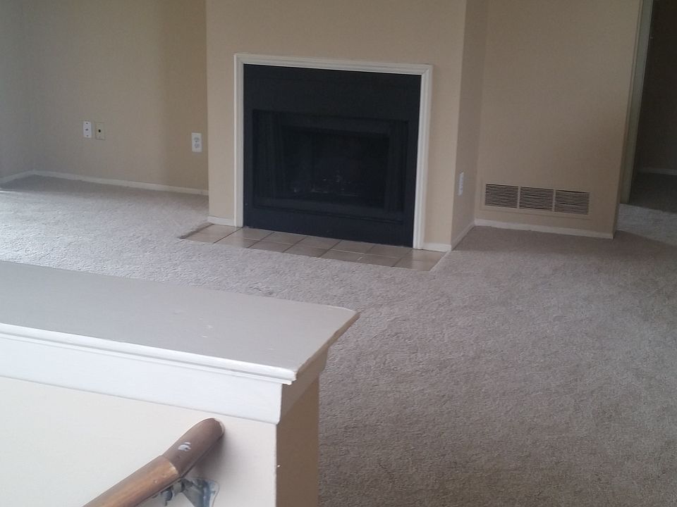 Living Room w/ Wood Burning Fireplace