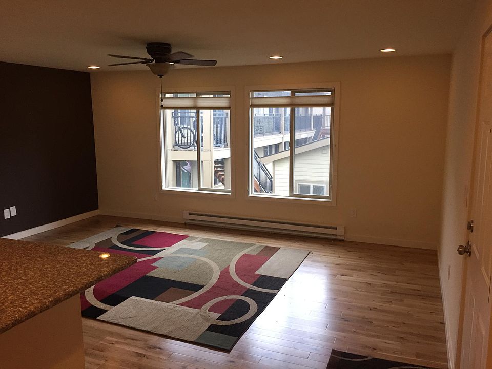 Large windows allow for natural light. Window shades can be adjusted from top or bottom to suit your privacy needs.