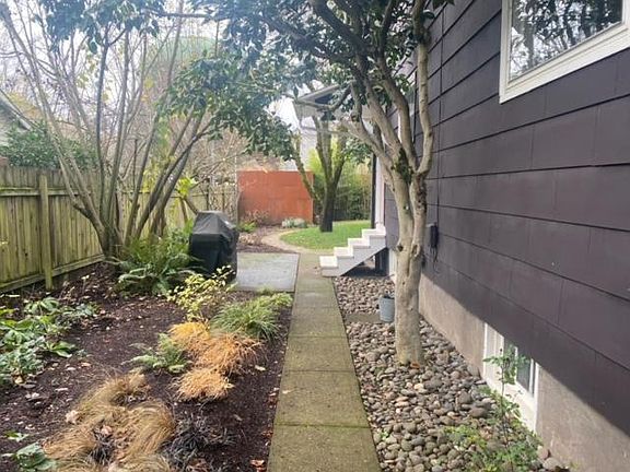 Side pathway to 2nd entry and to home.