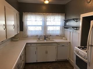 Kitchen with gas stove, dishwasher and refridgerator, this is an old picture it now has new backsplash, quartz counter tops, new sink and disposal