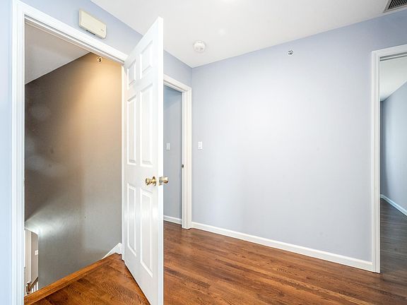 Entry to second floor unit with beautiful hardwood floors throughout.