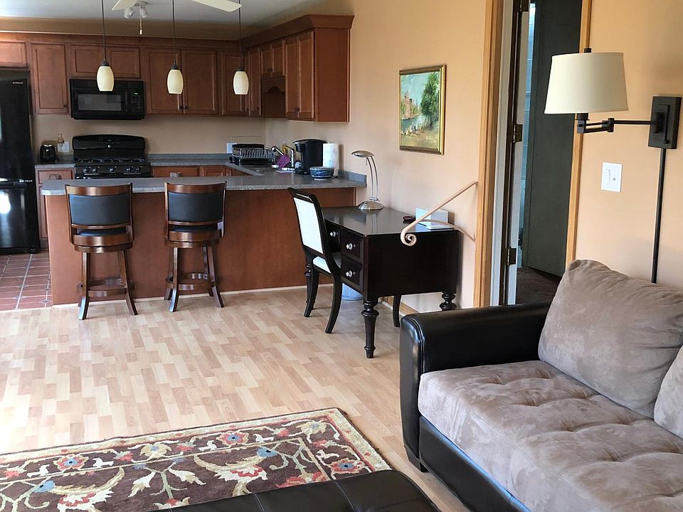 View from entrance towards desk and kitchen area