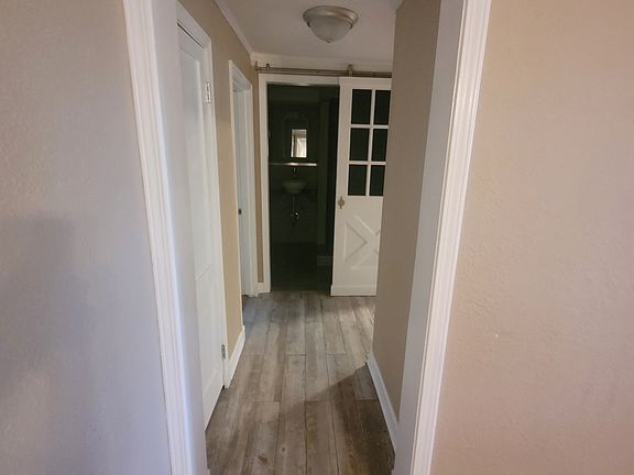 Hallway into bedrooms and bath.