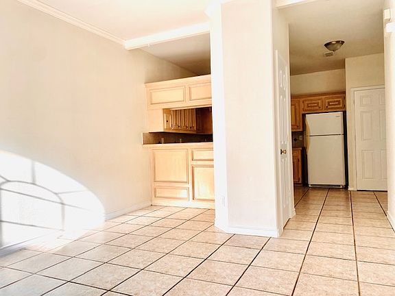 Spacious living room with sit down breakfast bar.