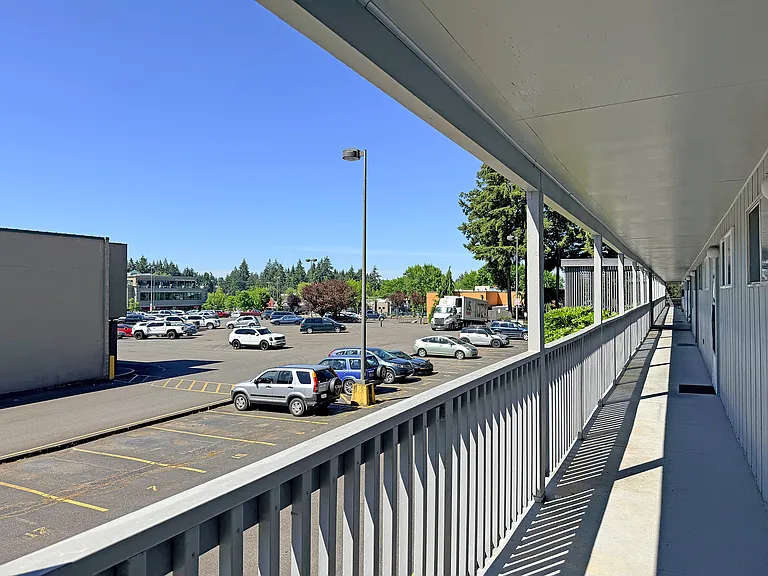 Front door view and the parking lot. One parking space is included.
