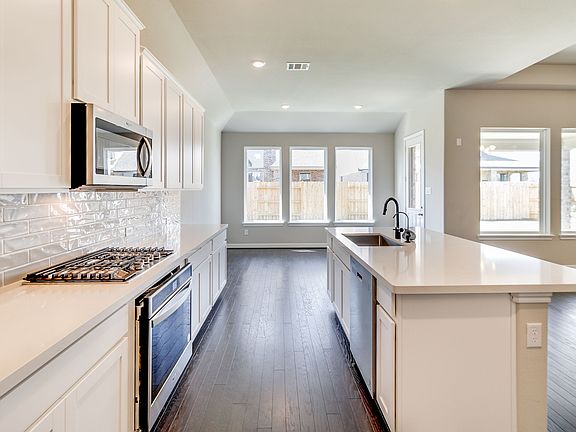 Kitchen open to family room and dining area