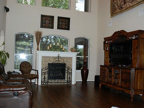 LIving Room with Wood Flooring with a fireplace