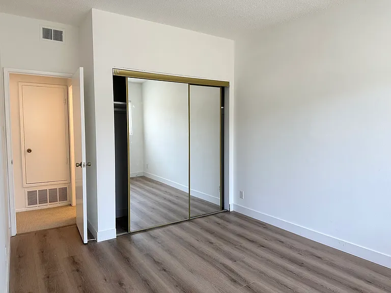 Bedroom #1 with mirrored closet
