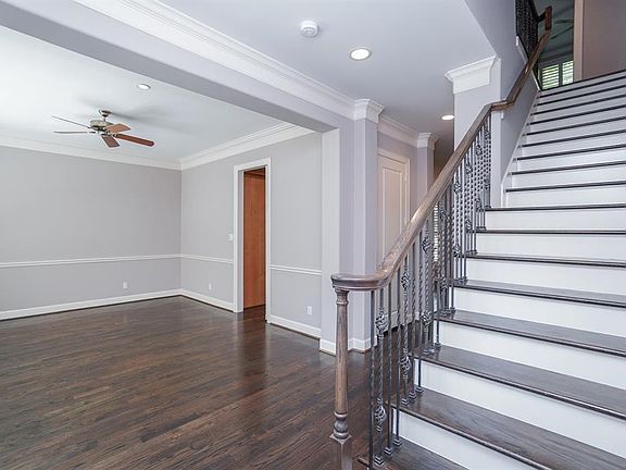 The layout of this home was carefully designed with convenience in mind. A stunning stairway leads out of the bright ground-floor entryway.