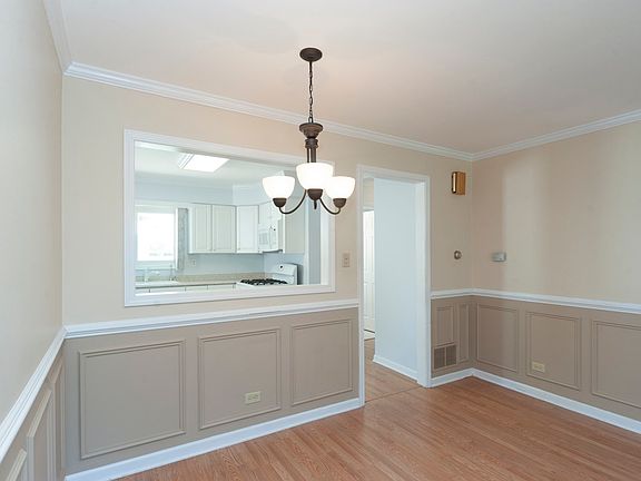 Dining room has decorative panels to distinguish it from the living room. Also open to the living room so you can expand your dining area when the need arrives.