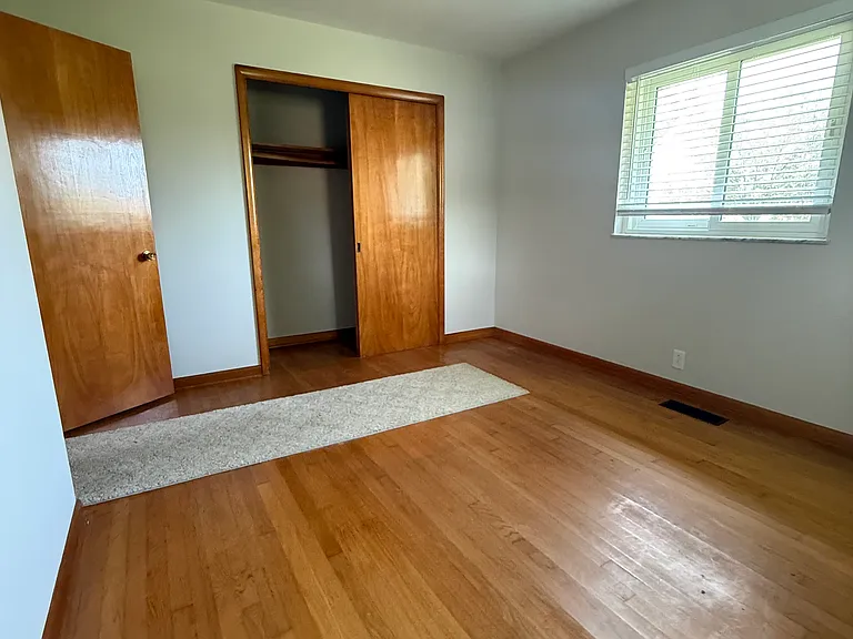 Main bedroom. Large closet, windows overlooking front and side yards.