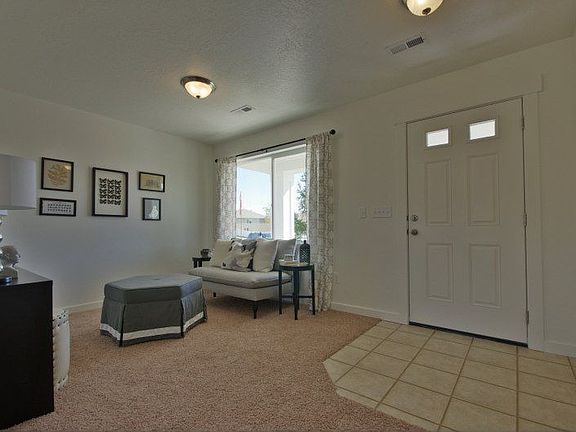 Photo is of a similar model home