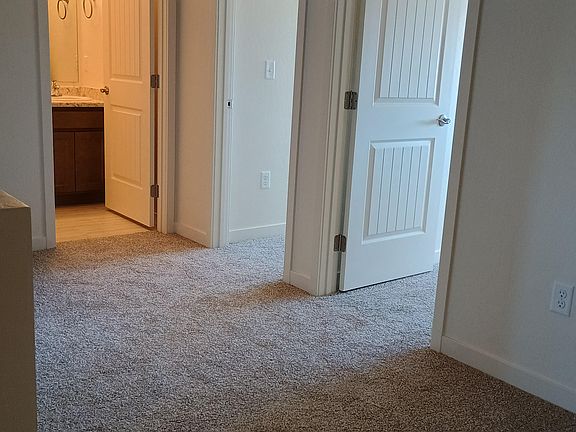 Landing at the top of the stairs. Room enough for a sitting area or a desk with plenty of room to maneuver.