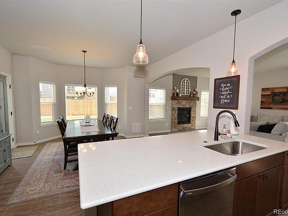 Quartz upgraded and large kitchen island with sink and high end fixtures. Drawers throughout house are "soft close" source: Pikes Peak Multiple Listing Service from prior sale of home