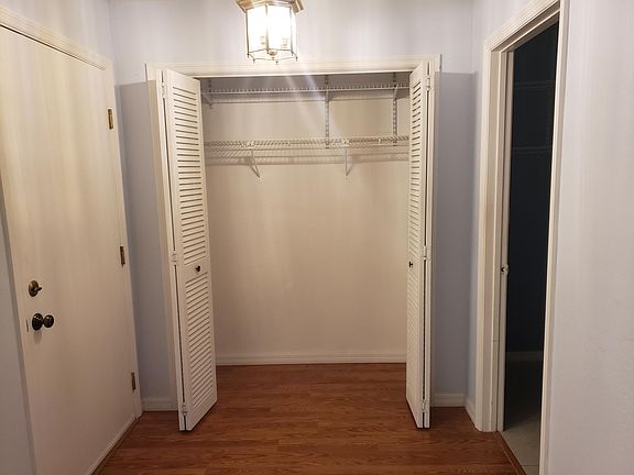 Large coat closet in entrance way. Entrance on left and laundry room on the right. All closets are lighted.