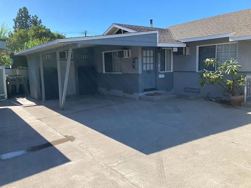 Front of unit with attached carport