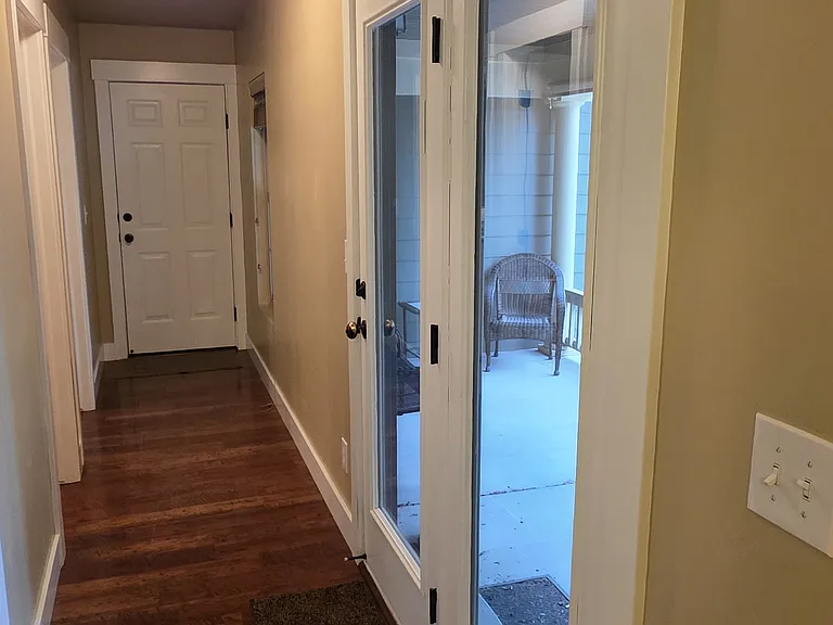 Hallway leading to yard and garage.