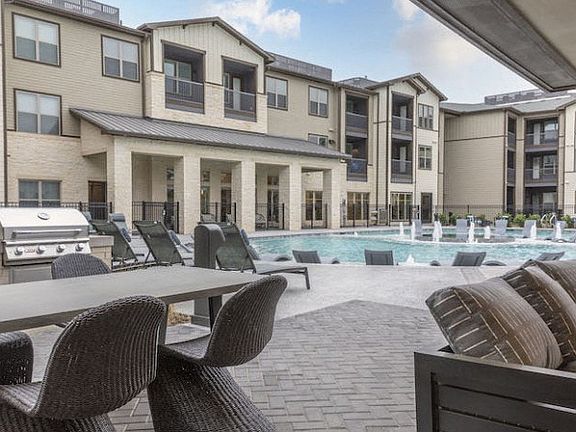 Resort-Style Pool with Grilling Area, Tanning Ledges, Cabanas & Hot Tub at The Bridge at McKinney