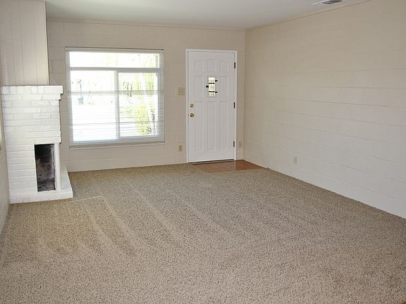 Front living room w/wood burning fireplace