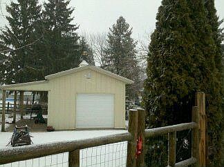 One car detached with covered concrete porch.Wonderful! 