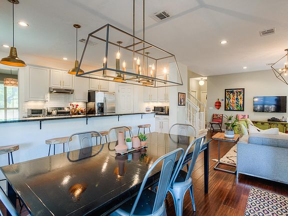 Dining table seats up to 8 and there are 5 bar stools