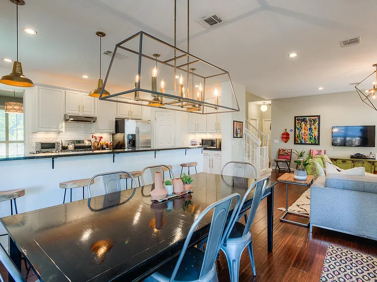 Dining table seats up to 8 and there are 5 bar stools