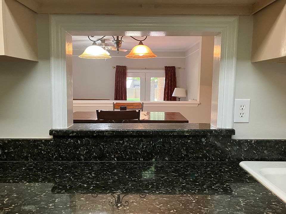 Kitchen view through pass-through all the way to the back deck